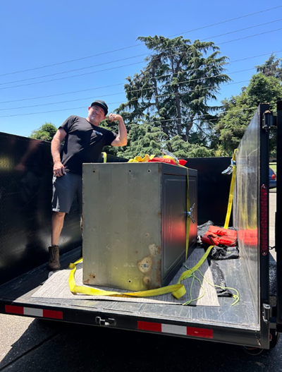 Man standing the dumpster